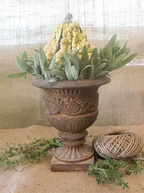 A vase with flowers in it sitting on top of a table.