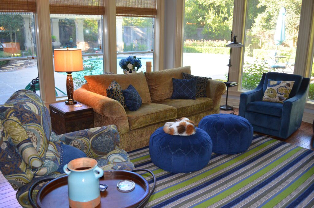 A living room with blue and brown furniture